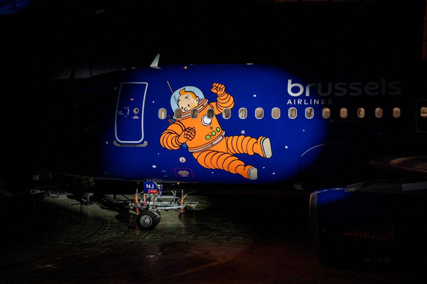 Airplane fuselage painted with Tintin in an orange spacesuit