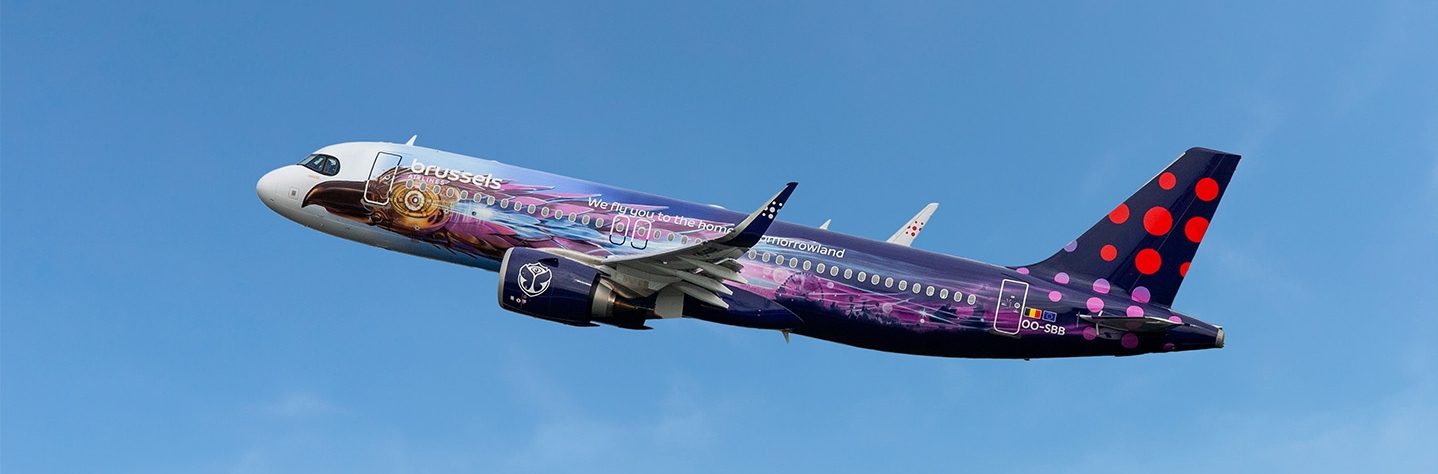Brussels Airlines Airbus in purple Tomorrowland Amare livery flying in a blue sky