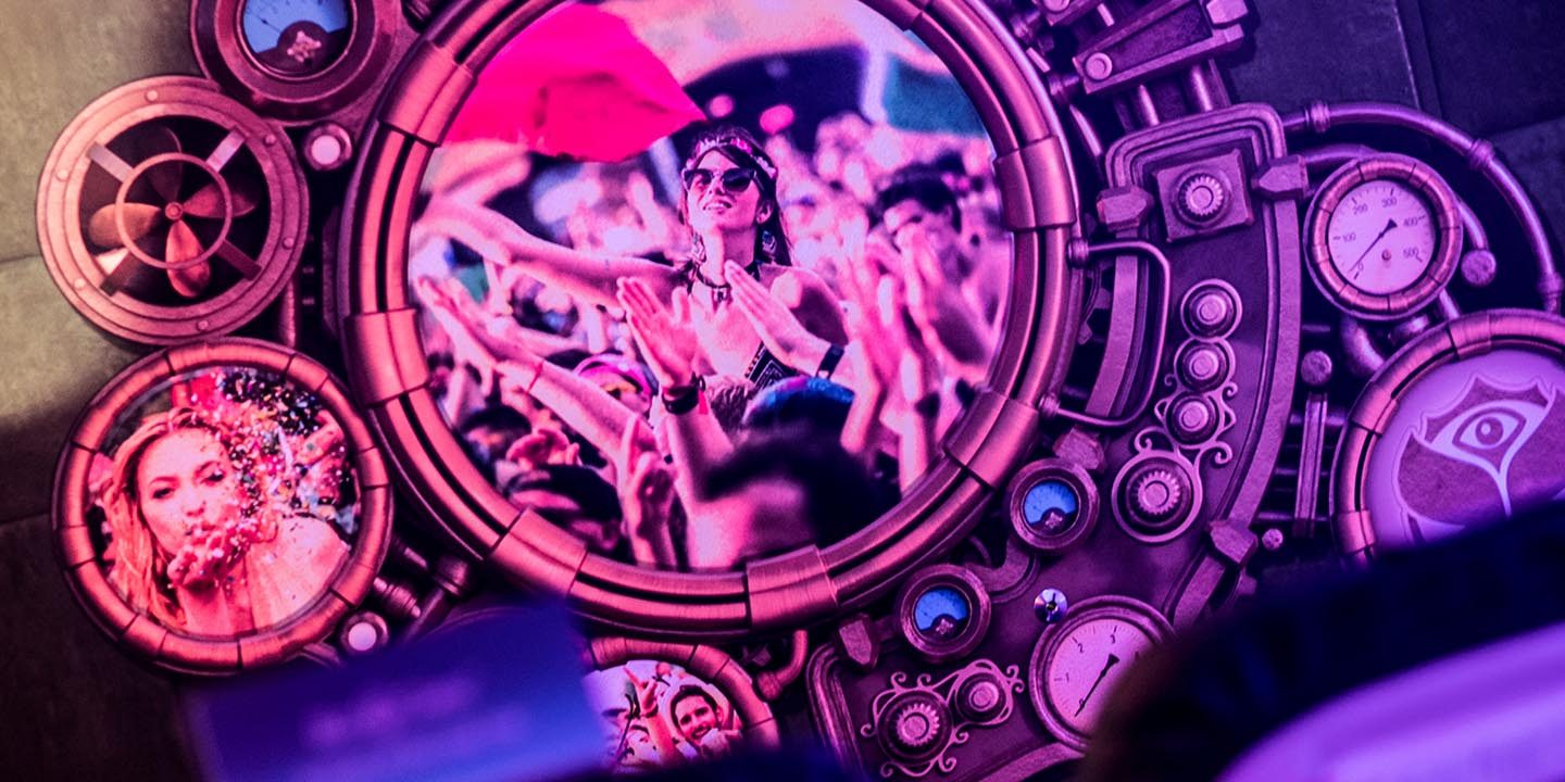 Purple illuminated Tomorrowland DJ stage.