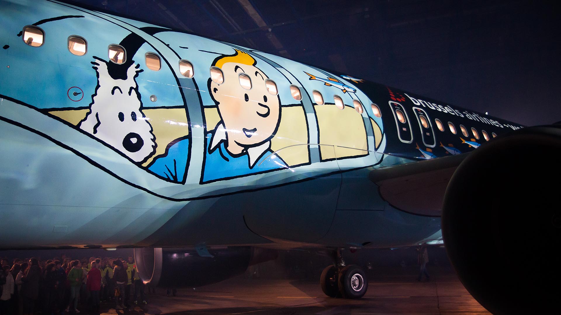 Aircraft fuselage painted with a Tintin and Snowy submarine design.